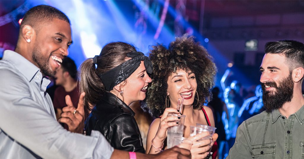 group of people celebrating in a night club in berlin