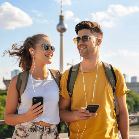 a young traveler couple in Berlin using the city audio guide app explory